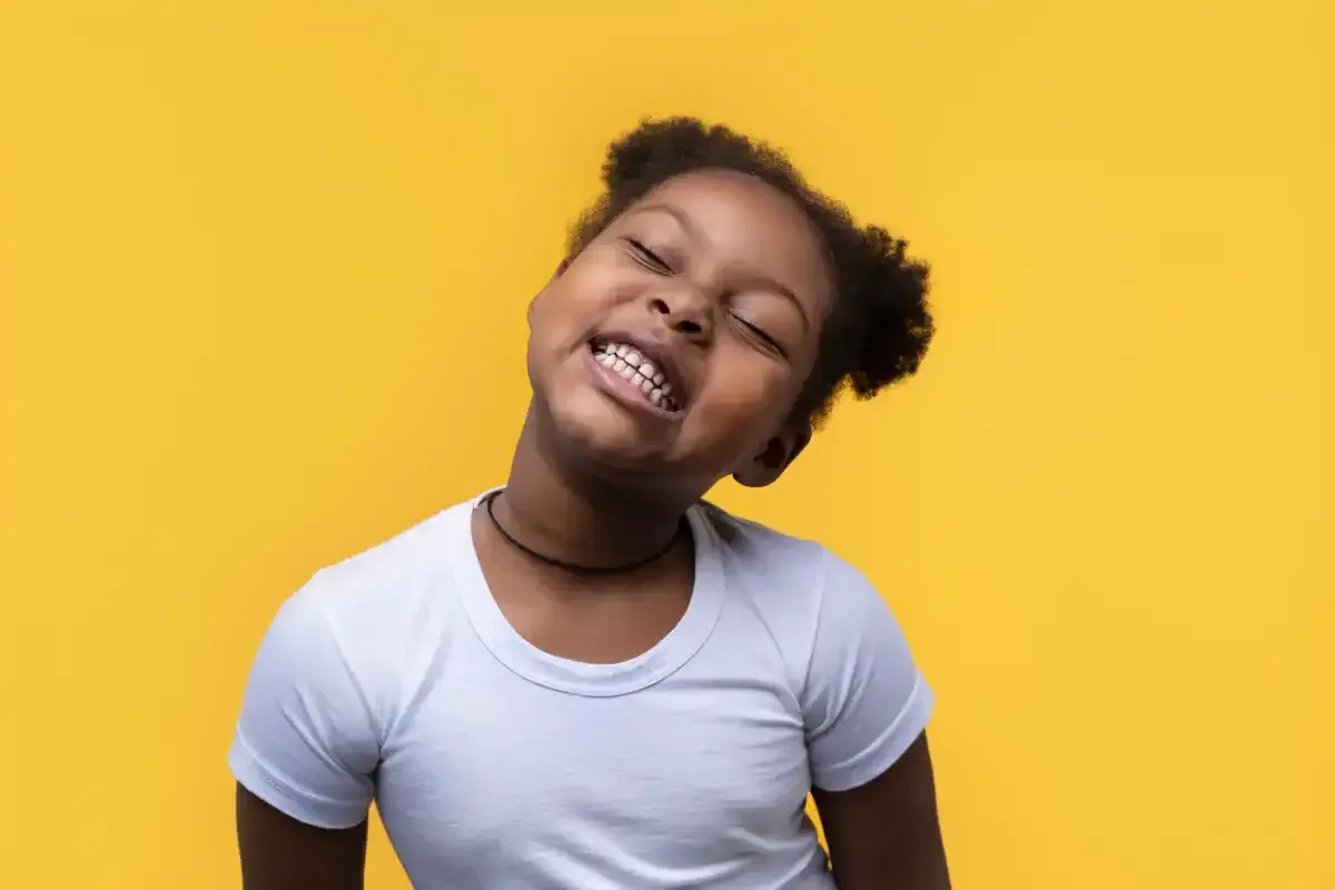 A Kid smiling after successful dental treatment